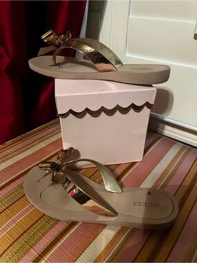 Guess Taupe Flip Flop Sandals with Gold Bow Detail